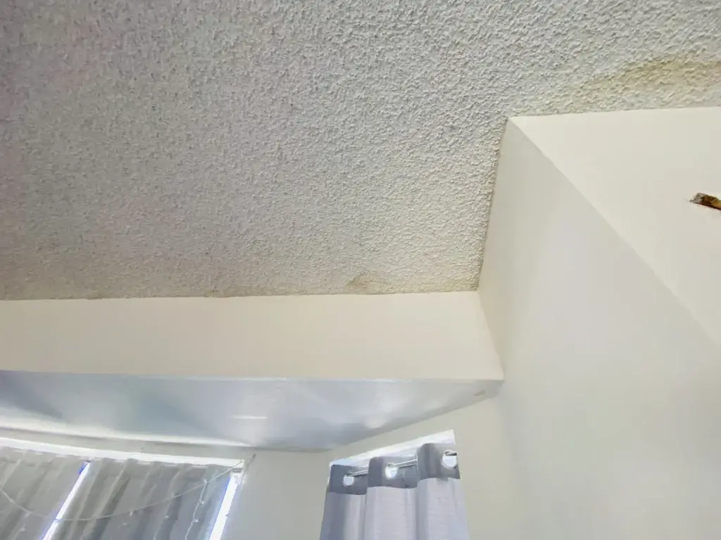 Popcorn ceiling stain above soffit
