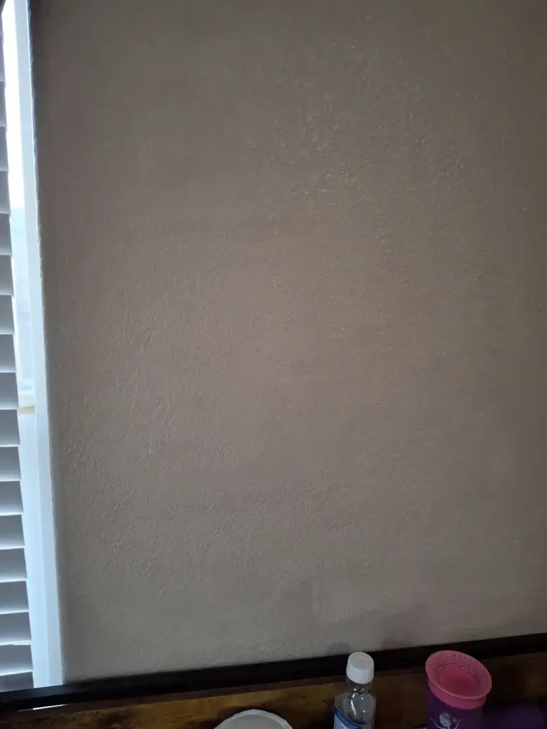 Repaired wall by window